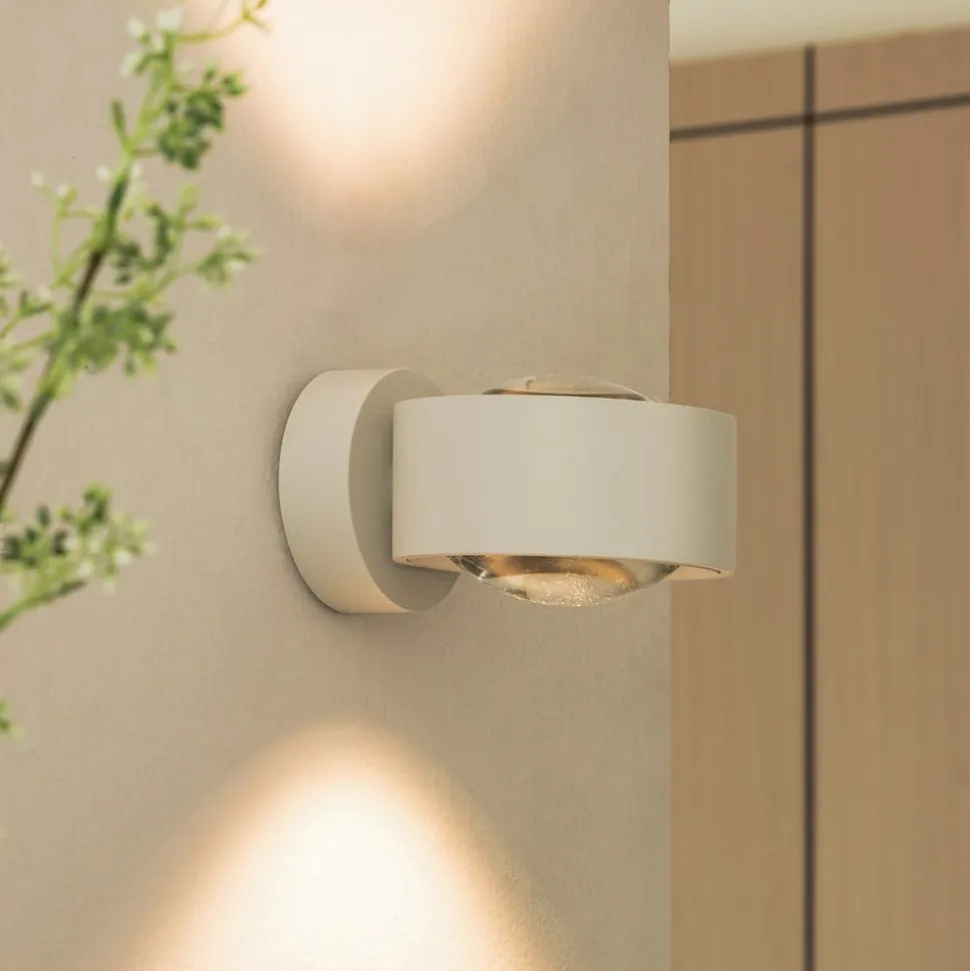 Arcchio LED-væglampe Rotari, linse, op/ned, hvid, metal
