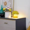 Lindby LED genopladelig bordlampe Nevijo, gul, Ø18cm, USB, dæmper