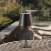 Lindby LED genopladelig bordlampe Janea CROSS, sort, metal