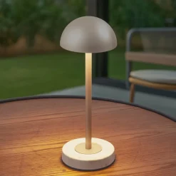 Lindby LED-batteridrevet bordlampe Pippin, guld/travertin, IP44
