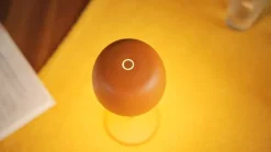 Lindby LED-bordlampe Arietty, orange, dæmpbar, IP65