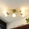 Lindby loftlampe Elaina, 66 cm, 5 lyskilder, messingfarvet, glas