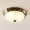 Lindby loftlampe Pakka, messingfarvet, glas, 31 cm, E27