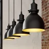 Lindby pendellampe Jasminka, sort/guld, metal, 4 lyskilder.