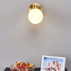 Lindby vægspot Elaina, messingfarvet, glas, 14 cm høj, E14