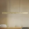 Lucande LED-hængelampe Nivara, 117 cm, guld, metal