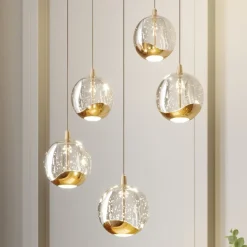 Lucande LED-pendellampe Hayley, Ø 30 cm, 5 lyskilder, guld, glas