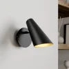 Lucande væglampe Wibke, højde 24 cm, sort, guld, metal
