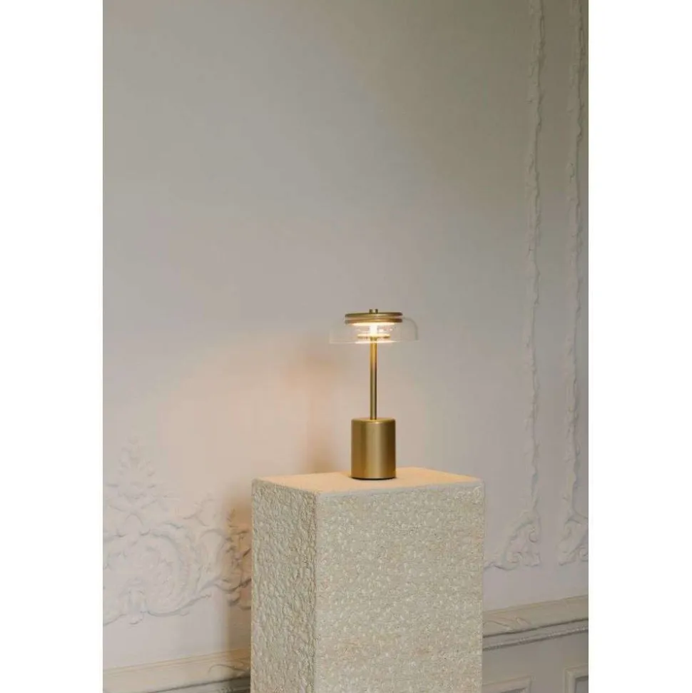 Nuura LED-batteridrevet bordlampe Blossi, højde 26 cm, guldfarvet/klar